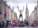 Circus street artist 'Reidiculous' performs for the Fringe crowds on the Royal Mile. Picture: Jane Barlow/PA Wire