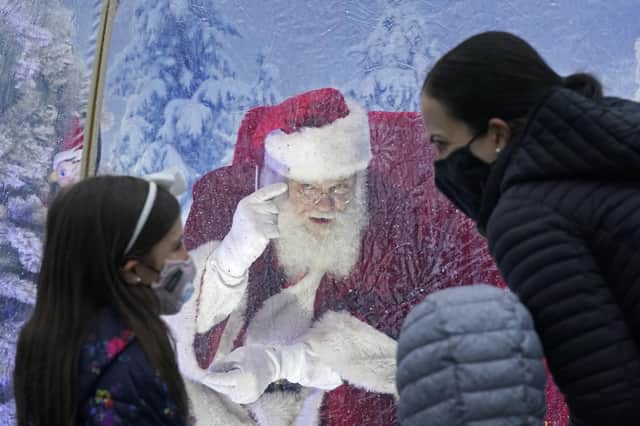 Santa would be very sad if he discovered how some people are buying up nice things so they can sell them on at a vastly inflated price over Christmas (Picture: Ted S Warren/AP)