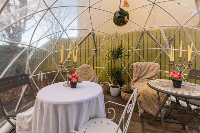 This conservatory dome is used as a dining area.