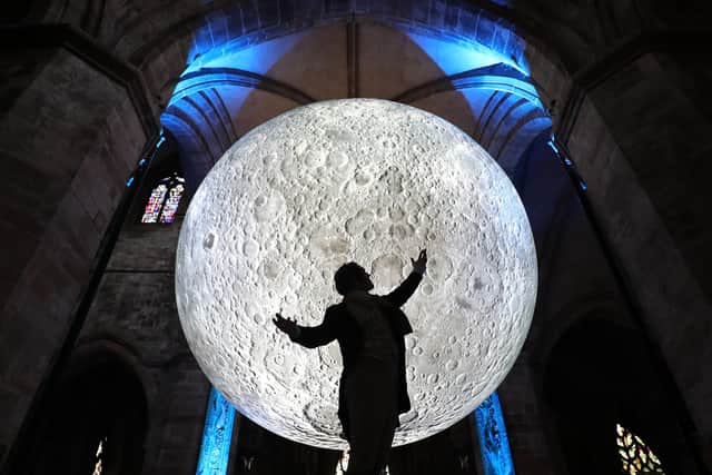 Luke Jerram's Museum of the Moon on a visit to St Giles' Cathedral in 2019