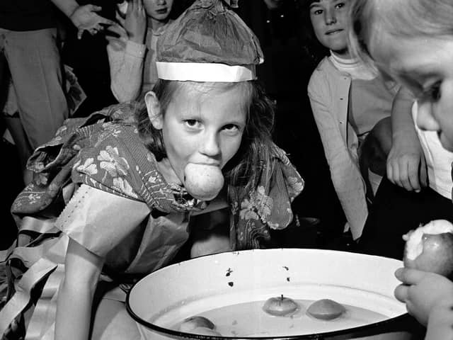 Children's Halloween party at Greenside Parish Church in Edinburgh in 1971, with Elizabeth Watson pictured dooking for apples.