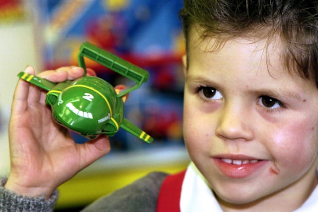 Calum Macleod is pictured holding a model Thunderbird 2 from the Thunderbirds TV series, one of the must-have toys for Christmas 1992.
