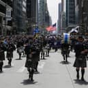 Bagpipers march along Sixth Avenue during a previous Tartan Day Parade in New York City (Picture: Eduardo Munoz Alvarez/Getty Images)
