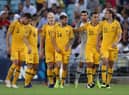 Martin Boyle (centre) and Jackson Irvine (far right) with their Australian international team-mates. Picture: Getty
