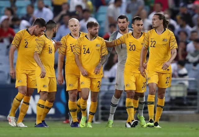 Martin Boyle (centre) and Jackson Irvine (far right) with their Australian international team-mates. Picture: Getty