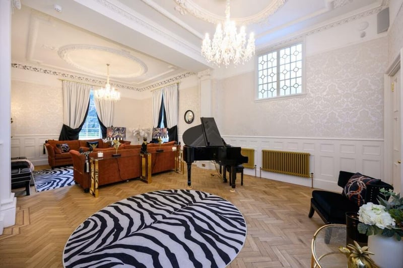This is a stunning room, with a large piano and plenty of space to relax.
