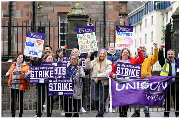 School support workers, who are members of Unison, on the picket line at Royal Mile Primary School in Edinburgh. Jane Barlow/PA Wire