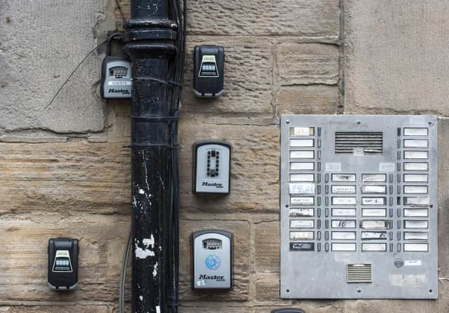 Key safes outside a tenement - a sign of flats being used for short term rentals, such as those booked through Airbnb. Those seeking a long-term place to live face ever rising rents as a result of the boom in holiday accommodation in the capital. PIC: Lisa Ferguson/ TSPL.