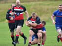 Darren Tiffney holds onto the ball for Lasswade. Photos by Dean Gibb.