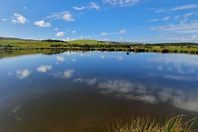 The Tweeddale Millennium Fishery near Gifford in East Lothian looking flat calm.