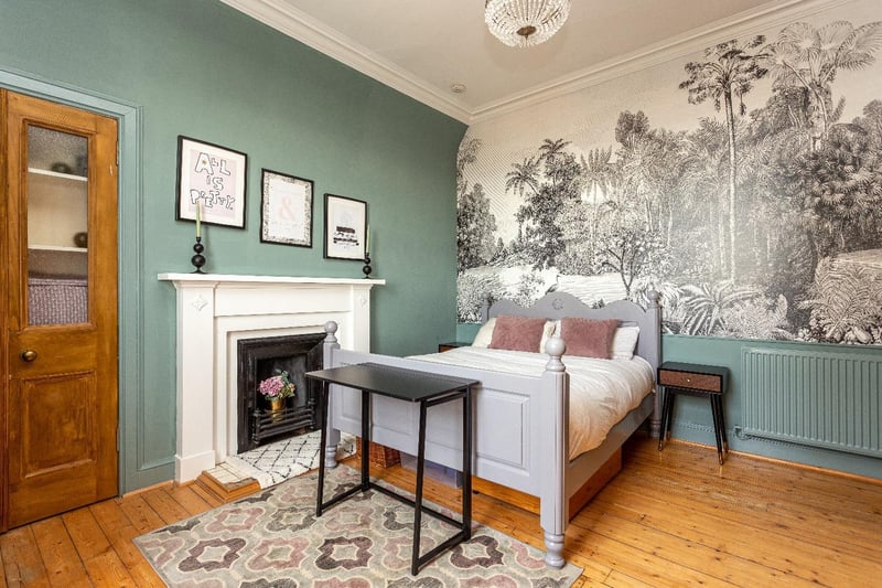 The principal bedroom is one of the two large bedrooms in the former school house.