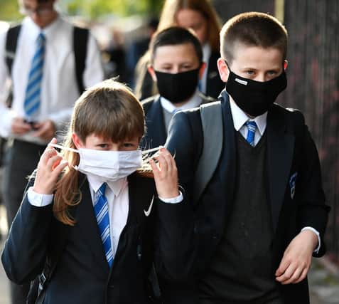 Pupils and parents have been reminded of the importance of face masks. Picture: John Devlin