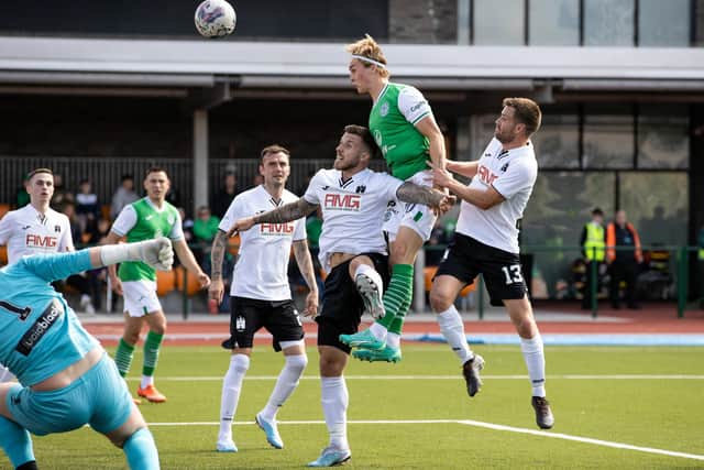 Melkersen leaps highest to score Hibs' first goal at Meadowbank. Picture: Craig Williamson/SNS Group