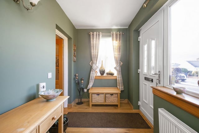 The property has a spacious entrance hall with plenty of space for storage and decorative pieces.