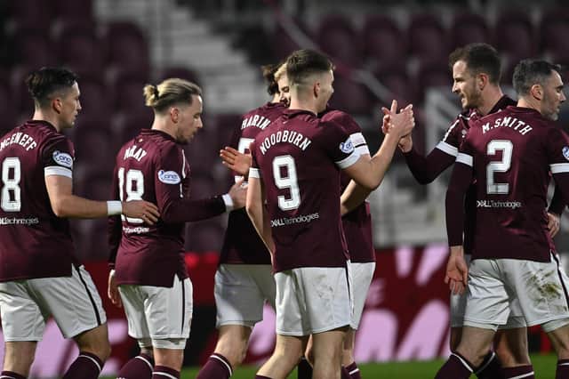 The Hearts players celebrate with Ben Woodburn after the Liverpool loanee put his side 2-0 up against Ross County. Picture: SNS