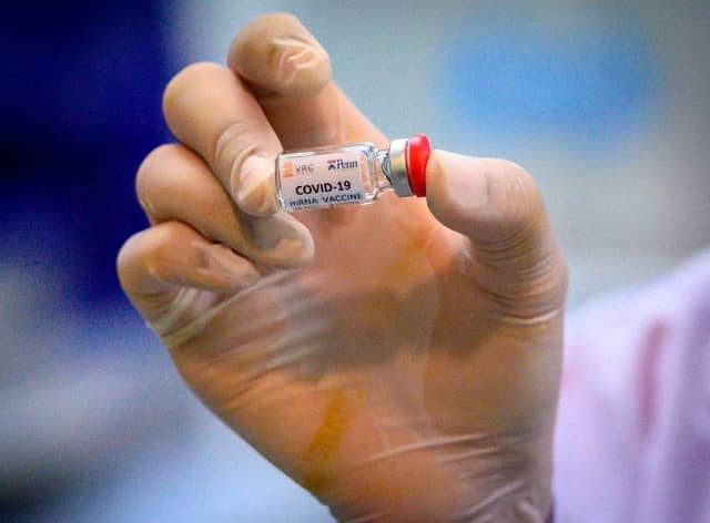 It could be some time before the world returns to 'normal', even in the face of successful vaccines (Photo: MLADEN ANTONOV/AFP via Getty Images)