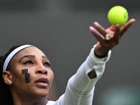 US player Serena Williams wearing plasters on her face during the match with France's Harmony Tan at Wimbledon 2022 (Photo by GLYN KIRK/AFP via Getty Images)