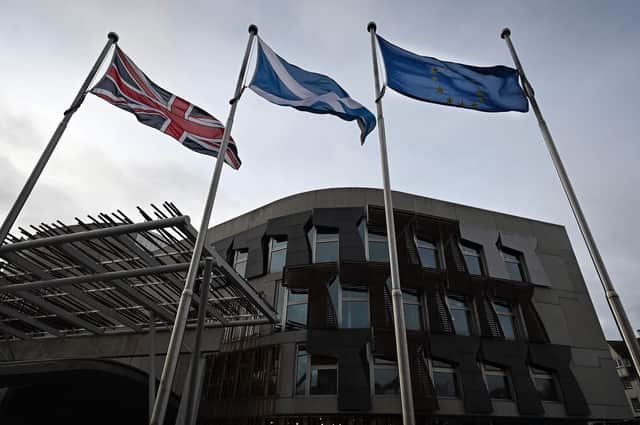 Flags outside the Scottish Parliament at Holyrood