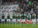 The Hibs players participate in a minute's applause to remember Brazilian football legend Pele ahead of the Edinburgh derby