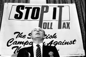 Party leader Neil Kinnock pictured in front of an anti-poll tax banner at a Scottish Labour Party conference on local government in Edinburgh in January 1988.