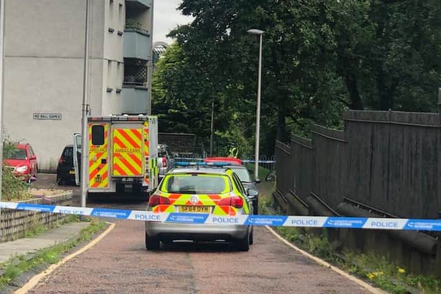 Police have taped off an area beside the Holyrood Court flats. Pic: Lisa Ferguson