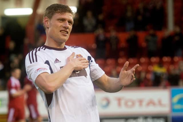 Hearts' Marius Zaliukas salutes the fans at full-time after making his final appearance for the club (Picture: SNS)