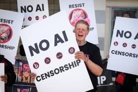 Protesters shout outside the annual Nvidia GTC Artificial Intelligence Conference at SAP Center in San Jose, California. (Photo: Josh Edelson/Getty Images)