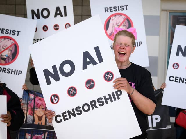 Protesters shout outside the annual Nvidia GTC Artificial Intelligence Conference at SAP Center in San Jose, California. (Photo: Josh Edelson/Getty Images)