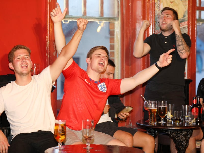 Celebrations at full-time. Fans watch England v Ukraine in the quarter finals of Euro 2020, in The Kings pub, Albert Rd, Southsea. Picture: Chris Moorhouse (jpns 030721-24)