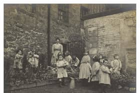 Lileen Hardy and children gardening at St Saviour's Child Garden