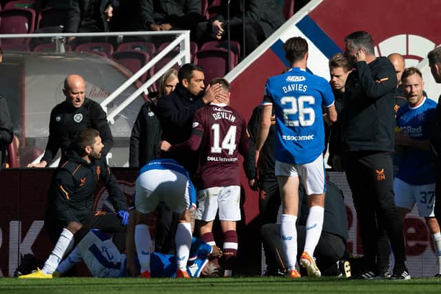 Rangers manager Giovanni Van Bronckhorst has a word with Cammy Devlin after the Hearts midfielder's red card at Tynecastle. Picture: SNS
