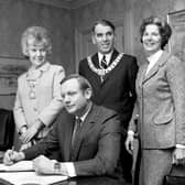 Astronaut Neil Armstrong signs the visitors' book at Edinburgh City Chambers in March 1972, watched by the then Lord Provost James McKay and his wife (Picture: Denis Straughan)