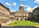 A former University of Edinburgh professor has been awarded £50,000 after her life was "destroyed" when she alerted bosses to perceived sex discrimination