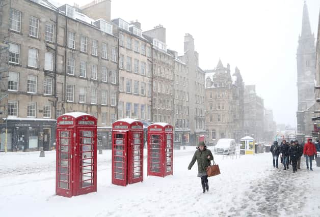 One woman bravely trudged through the heavy snow up Edinburgh's Royal Mile, after Storm Emma and the Beast from the East hit the Capital.