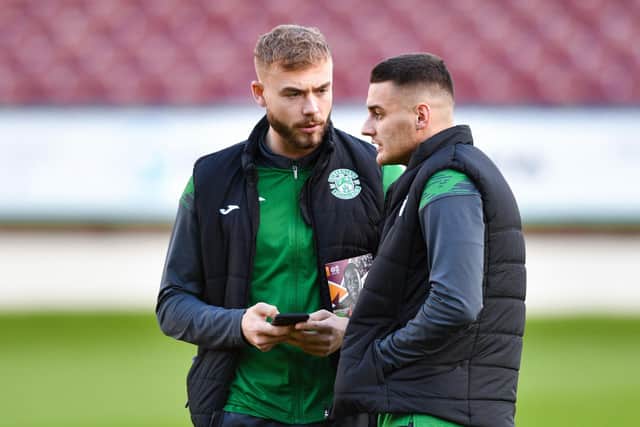 Ryan Porteous chats with Kyle Magennis ahead of kick-off between Motherwell and Hibs