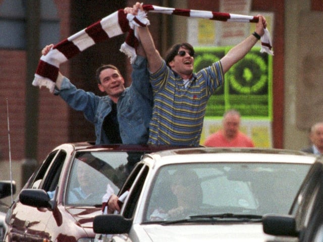 Hearts fans at Tynecastle celebrate their team winning the Tennents Scottish Cup in 1998, after beating Rangers 2-1 in Glasgow.