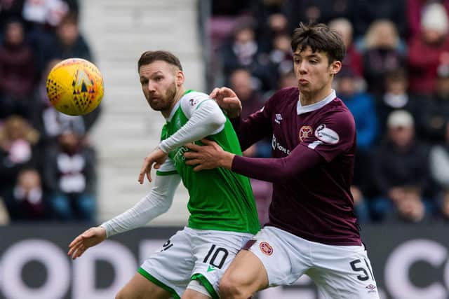 Martin Boyle and Aaron Hickey battle for possession during the last Edinburgh derby. Picture: SNS
