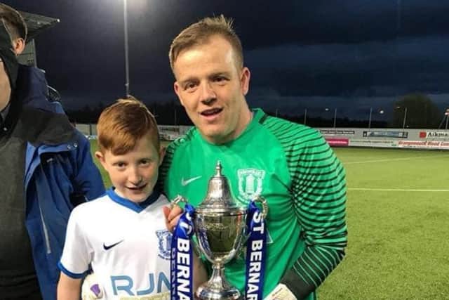 Ronald with Dylan after winning a cup with Bernards AFC