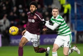 Ellis Simms battles with Celtic's Carl Starfelt for possession during his Hearts debut at Tynecastle Park on Wednesday evening. Picture: SNS