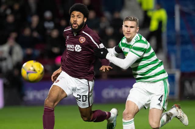 Ellis Simms battles with Celtic's Carl Starfelt for possession during his Hearts debut at Tynecastle Park on Wednesday evening. Picture: SNS