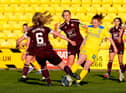 Hearts' Tegan Browning  battles with Hibernian's Colette Cavanagh during this month's SWPL1 derby. The Edinburgh rivals will be competing for players off the pitch with semi-pro contracts