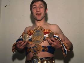 Edinburgh boxing legend Ken Buchanan holding world title belt (Photo PA)