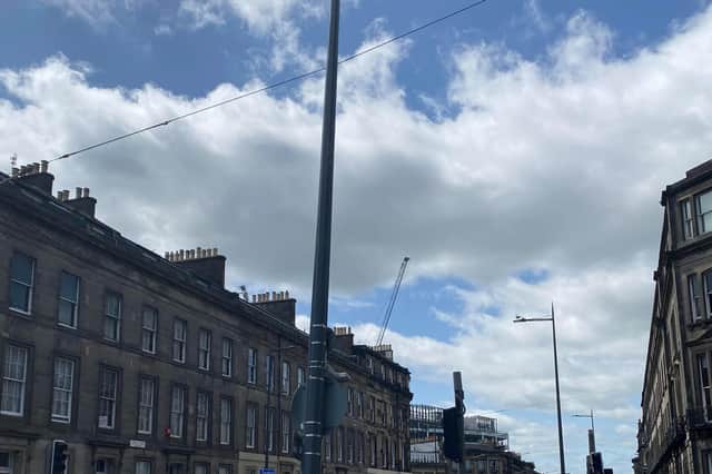 A lorry reversed into a lamp post which is now leaning against the supporting wires of the overhead line at Atholl Place in Edinburgh (Photo: Edinburgh Trams)