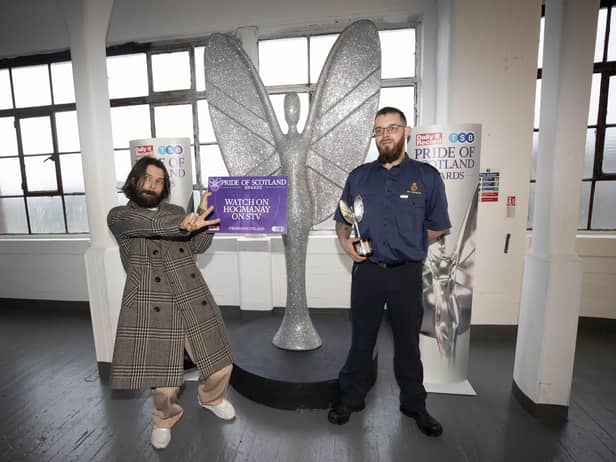 Jamie Newlands (right) who was honoured at the inaugural Pride of Scotland Awards, and was presented his award by Simon Neil from Biffy Clyro (left) at Broadscope Studios Glasgow.