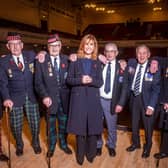Bill Hall from Bonnyrigg (third from left) is pictured on stage with Jackie Bird and his fellow veterans.