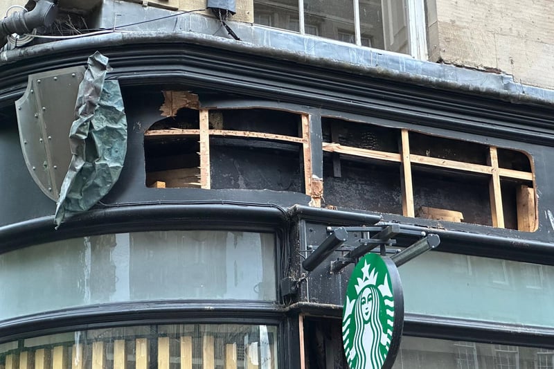 Somehow the Starbucks sign survived, but other parts of the building were not so lucky.