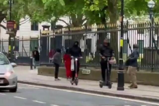 Pedestrian forced to step back to avoid an e-scooter being illegally ridden on a pavement. Picture: National Federation of the Blind of the UK