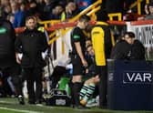 Lee Johnson watches on as referee David Munro studies the VAR monitor during Hibs' 4-1 defeat by Aberdeen