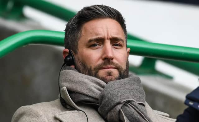 Lee Johnson, serving a one-game touchline ban, watches on from the directors' box at Easter Road