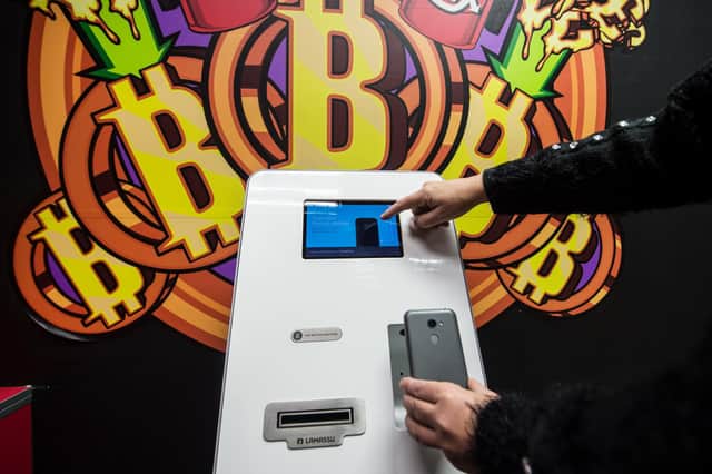 The Bitcoin cryptocurrency has even found itself into ATMs. Picture: John Devlin